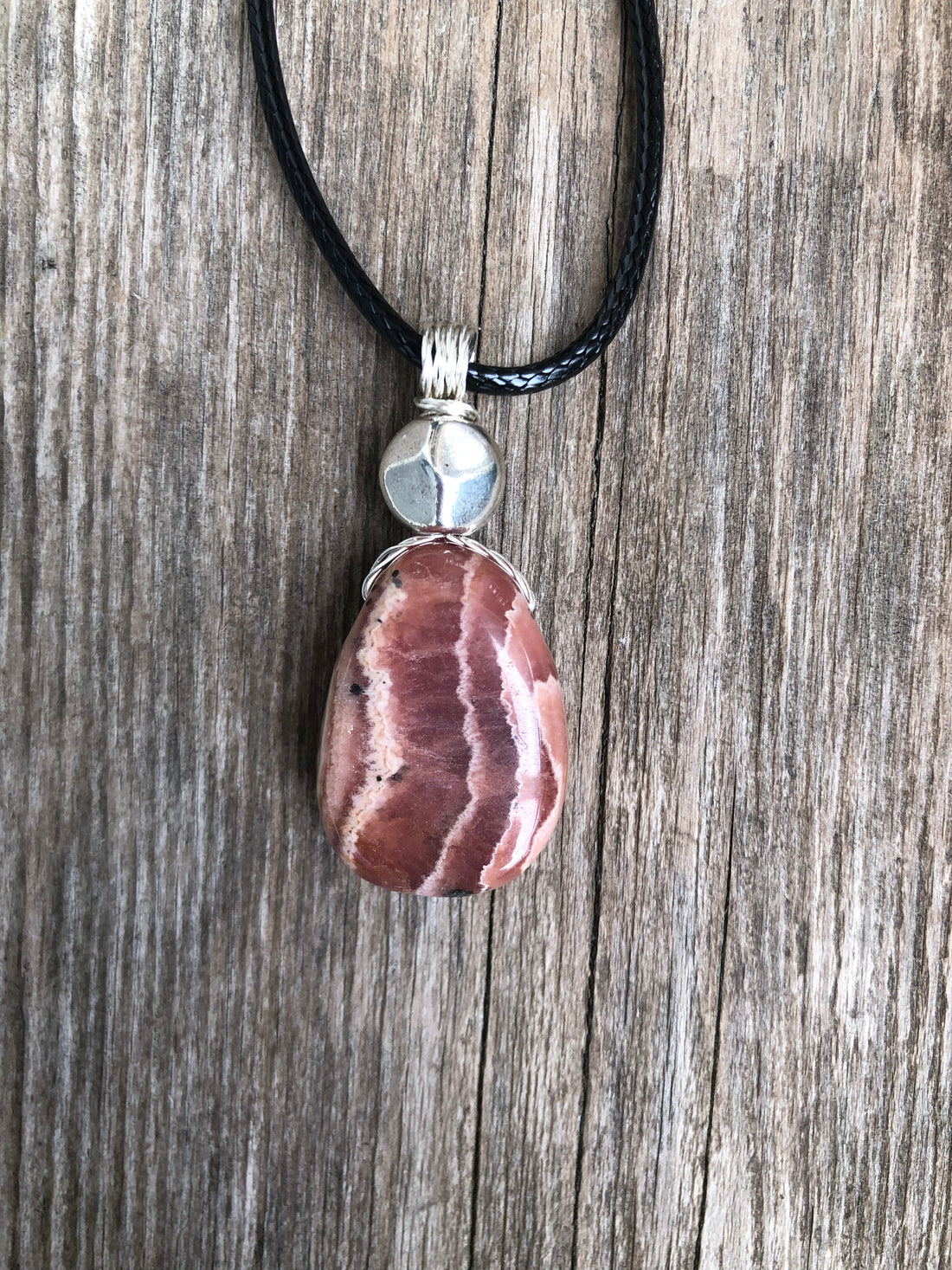 Rhodochrosite for Positivity and Love. Accent Piece is Pewter.