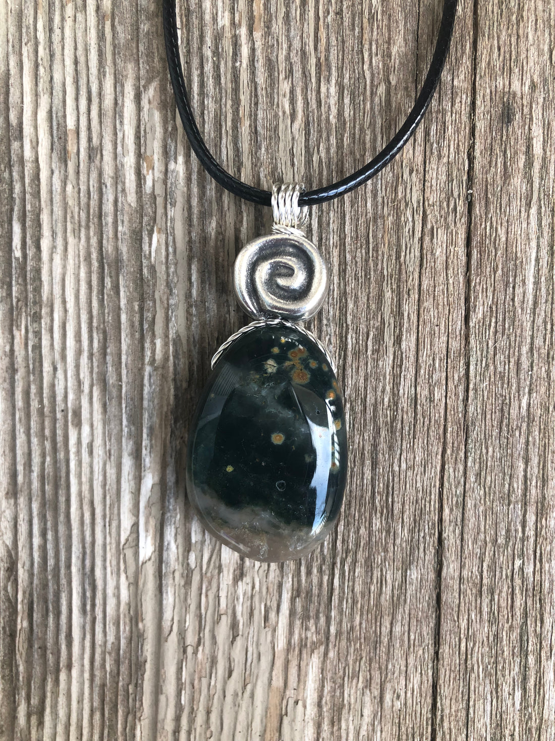 Ocean Jasper for Positivity, Forward Movement. Swirl to Signify Consciousness.