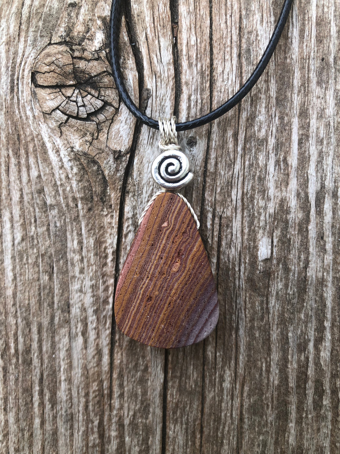 Rhyolite for Igniting Potential, Strength and Creativity. Swirl to Signify Consciousness.