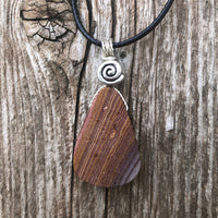 Rhyolite for Igniting Potential, Strength and Creativity. Swirl to Signify Consciousness.