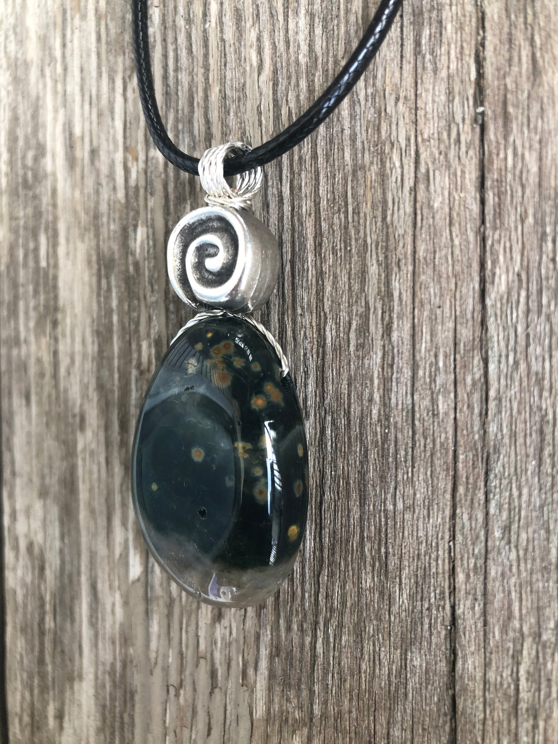 Ocean Jasper for Positivity, Forward Movement. Swirl to Signify Consciousness.