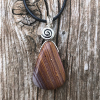 Rhyolite for Igniting Potential, Strength and Creativity. Swirl to Signify Consciousness.