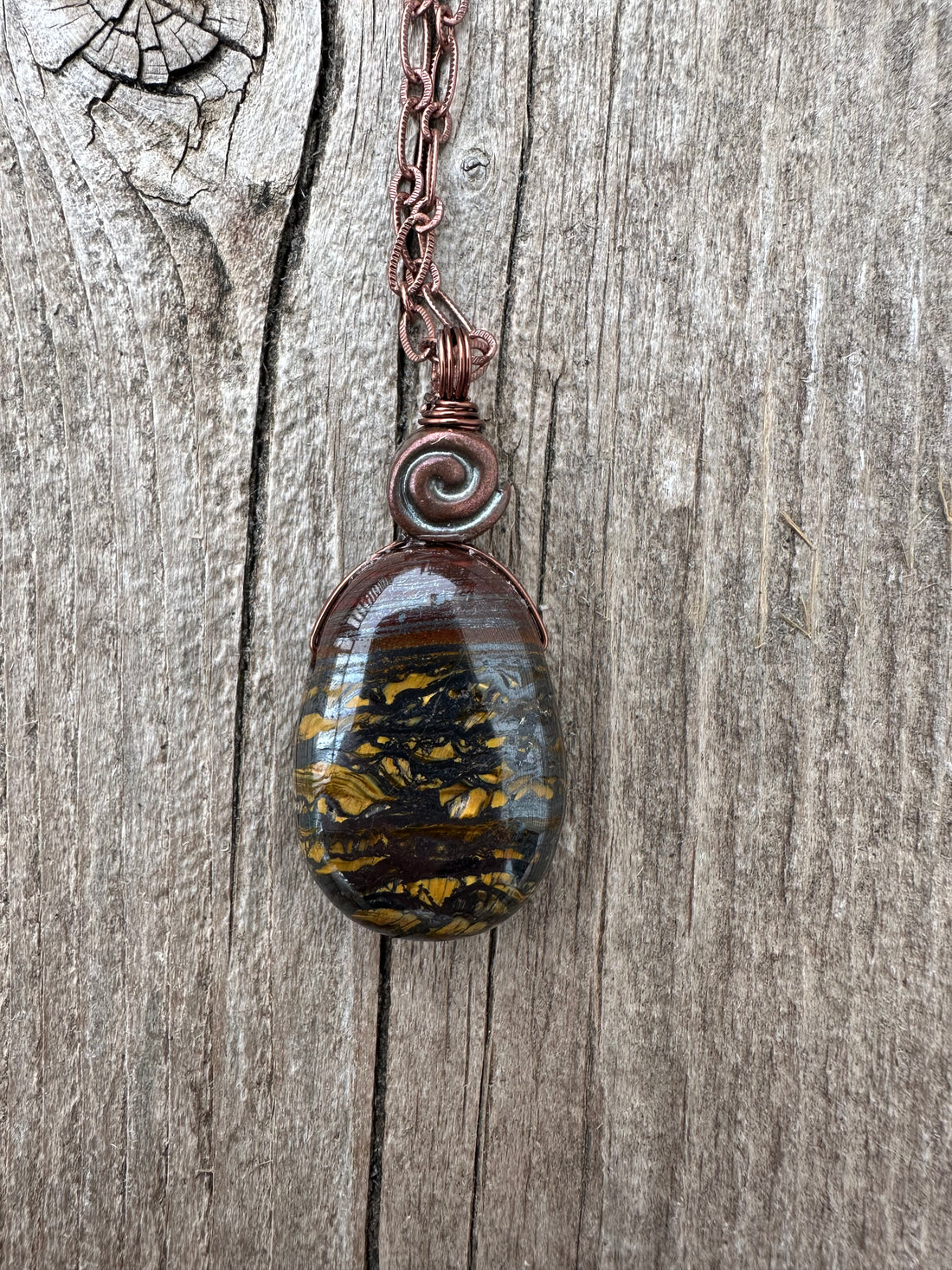 Tiger Iron Pendant for Vitality and Support Through Transitional Periods. Swirl Signifies Consciousness