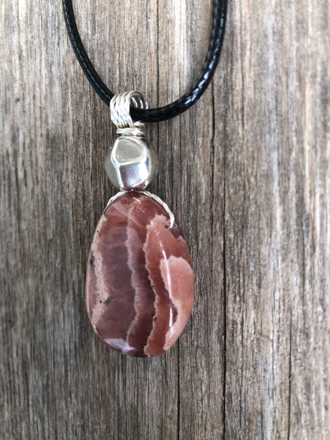 Rhodochrosite for Positivity and Love. Accent Piece is Pewter.