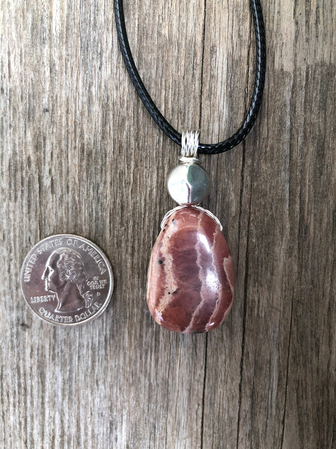 Rhodochrosite for Positivity and Love. Accent Piece is Pewter.