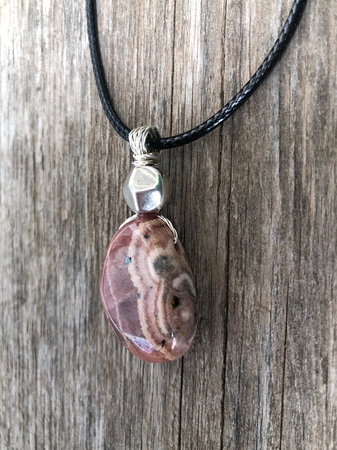 Rhodochrosite for Positivity and Love. Accent Piece is Pewter.