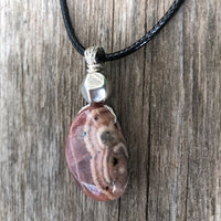 Rhodochrosite for Positivity and Love. Accent Piece is Pewter.