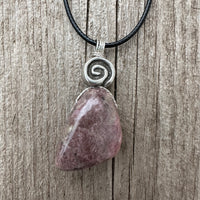 Rhodonite for Compassion, Balancing Emotions, and Self Confidence. Swirl to Signify Consciousness.