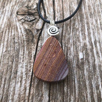 Rhyolite for Igniting Potential, Strength and Creativity. Swirl to Signify Consciousness.