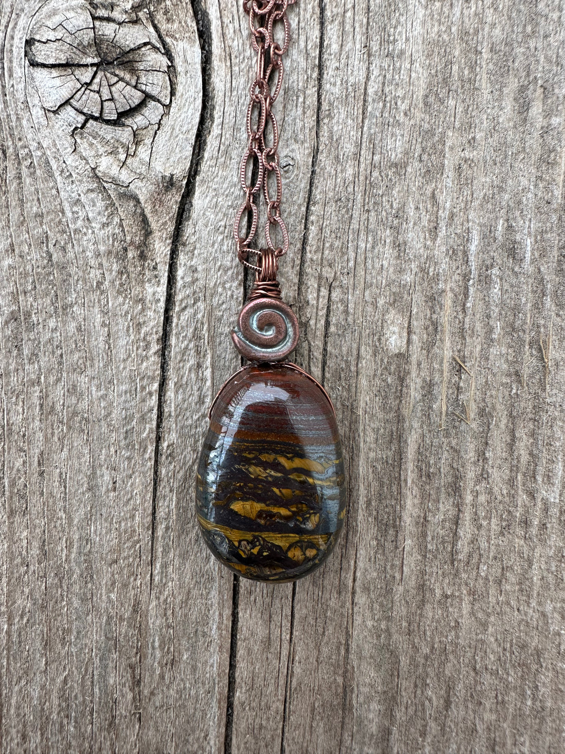Tiger Iron Pendant for Vitality and Support Through Transitional Periods. Swirl Signifies Consciousness