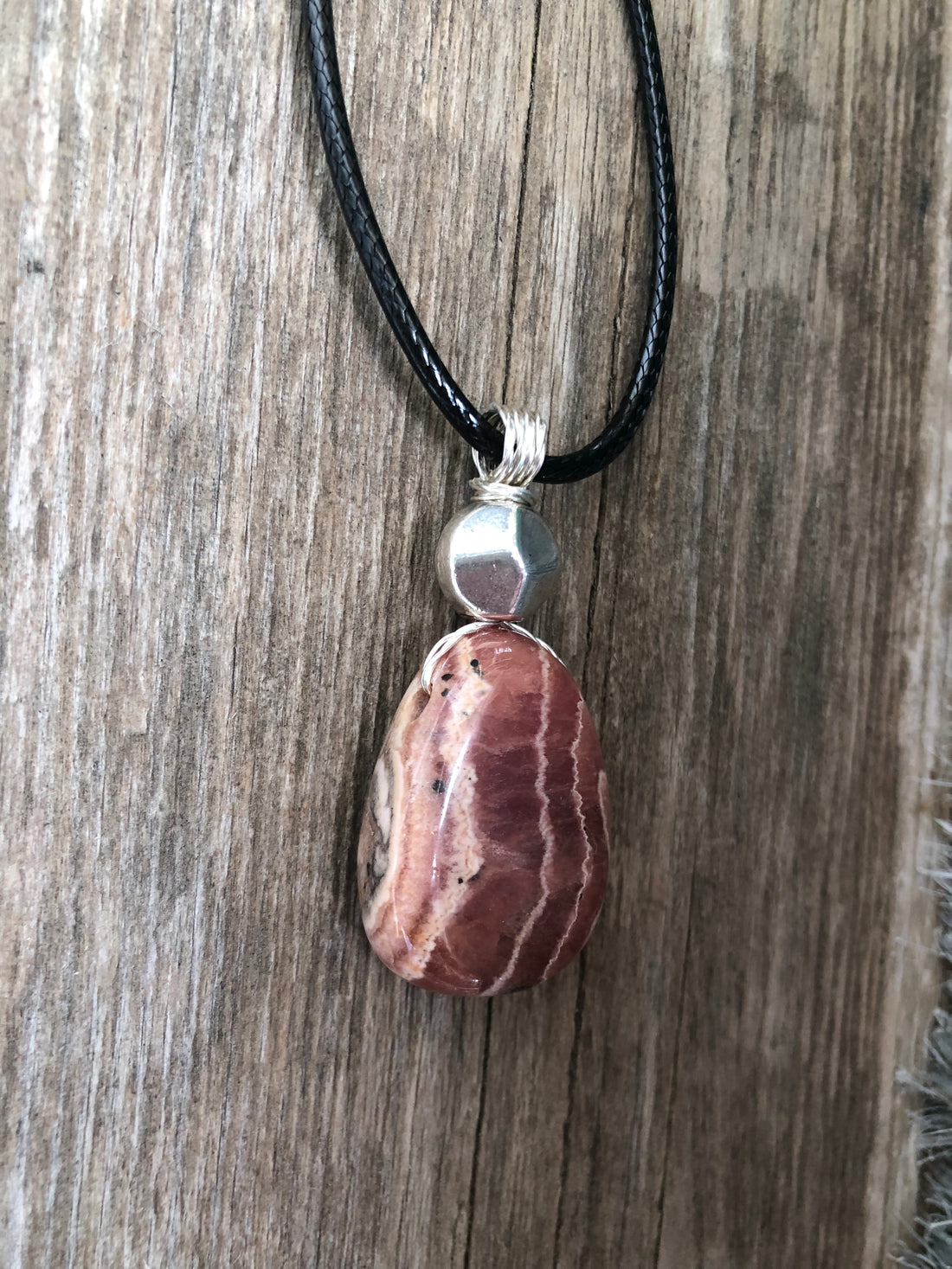 Rhodochrosite for Positivity and Love. Accent Piece is Pewter.