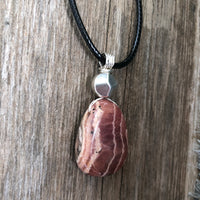 Rhodochrosite for Positivity and Love. Accent Piece is Pewter.