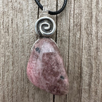 Rhodonite for Compassion, Balancing Emotions, and Self Confidence. Swirl to Signify Consciousness.