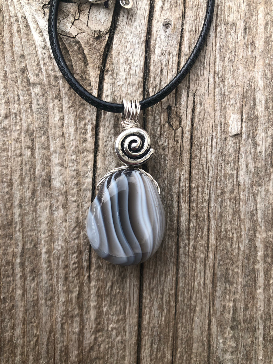 Botswana Agate for Energizing the Auric Field and Bringing Solutions. Swirl to Signify Consciousness.
