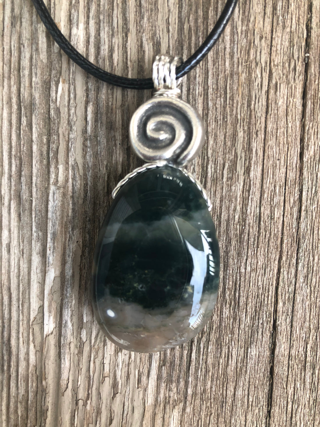 Ocean Jasper for Positivity, Forward Movement. Swirl to Signify Consciousness.