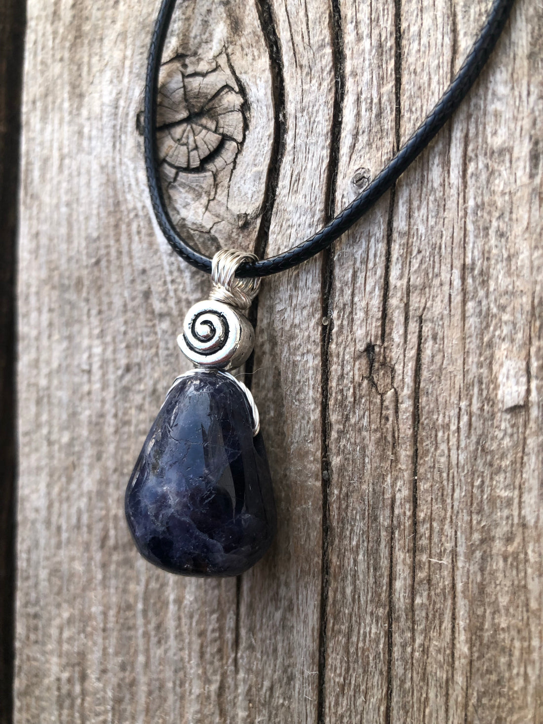 Iolite to Awaken Psychic Abilities. Used in Shamanic Practices. Swirl to Symbolize Consciousness.