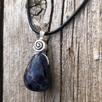 Iolite to Awaken Psychic Abilities. Used in Shamanic Practices. Swirl to Symbolize Consciousness.