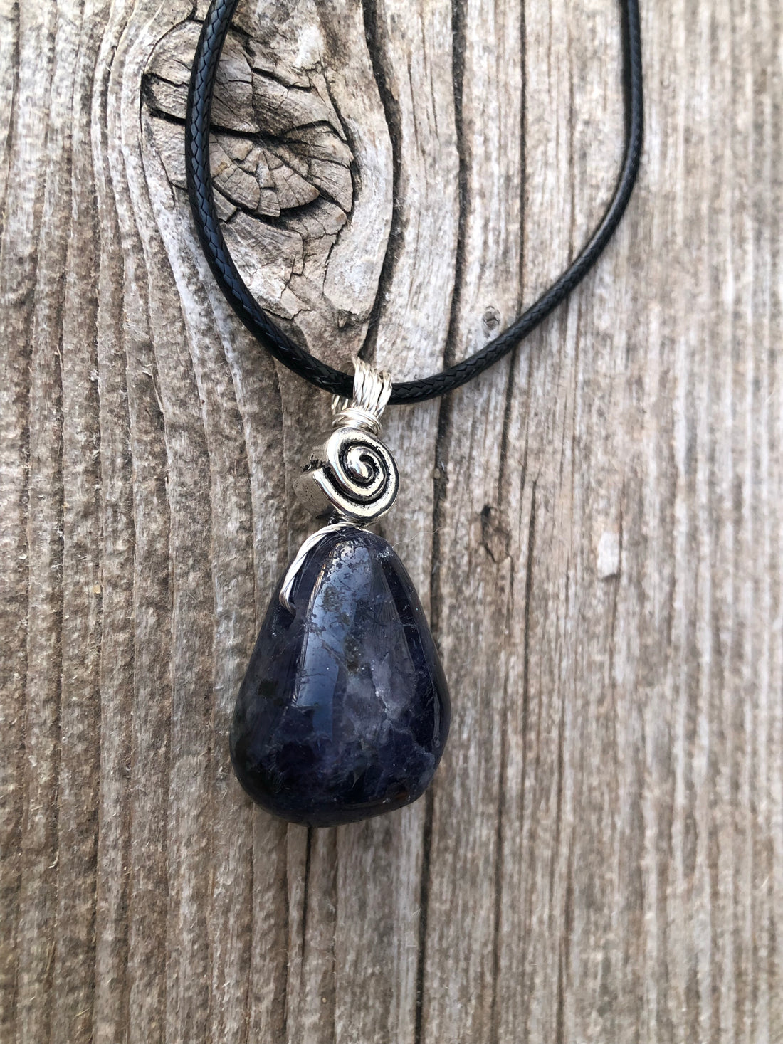 Iolite to Awaken Psychic Abilities. Used in Shamanic Practices. Swirl to Symbolize Consciousness.