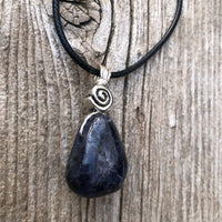 Iolite to Awaken Psychic Abilities. Used in Shamanic Practices. Swirl to Symbolize Consciousness.