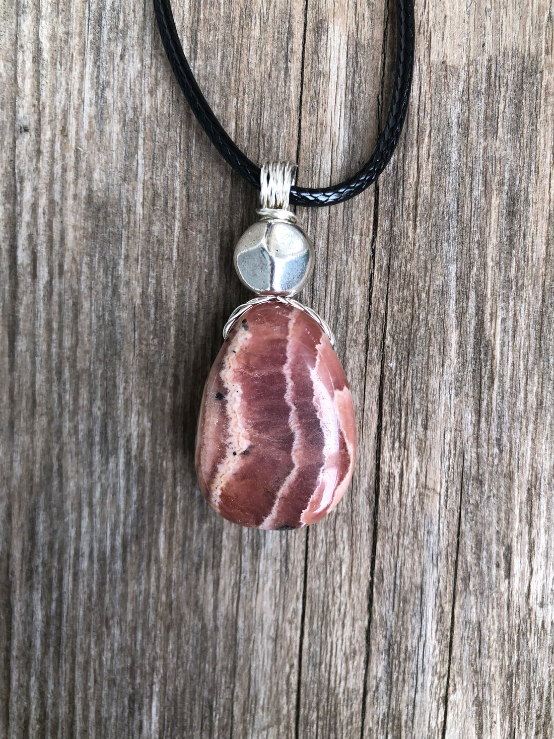 Rhodochrosite for Positivity and Love. Accent Piece is Pewter.