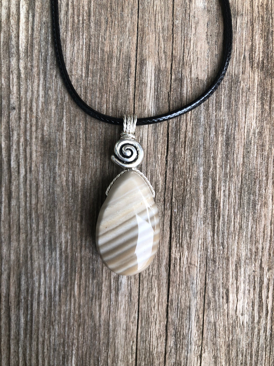 Flint for Grounding and Past Life Work. Swirl to Signify Consciousness.